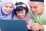 Asian family browsing internet