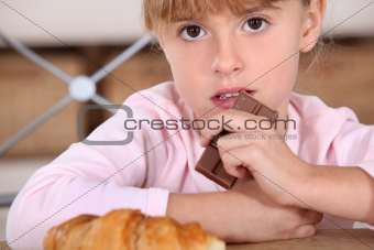 little girl having snack after school