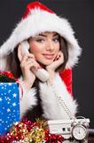 Smiling Santa girl on the phone