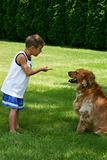Boy Instructing Dog