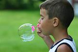 Boy Blowing a Bubble