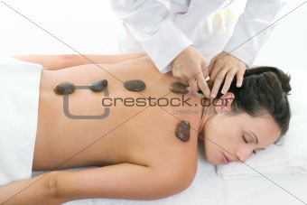 Female receiving a relaxing massage treatment