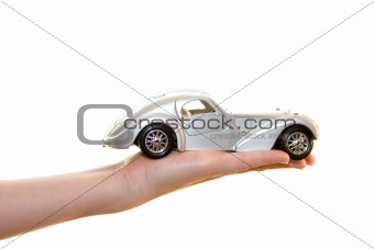 Car toy on palm