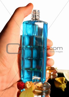 Bottle of Parfume in Hand - Isolated on white