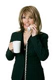 Woman with coffee answers a phone