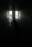 Child running in dark room in Fort Desoto, Florida