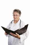 Mature Female Doctor Reviewing Chart