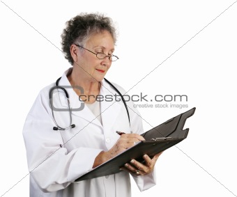 Mature Female Doctor Taking Notes