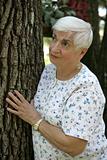 Senior Woman Beside Tree