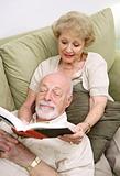 Wife Reading to Husband