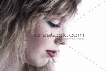 Studio portrait of a curly blond female