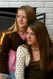Pretty Sisters by Fireplace