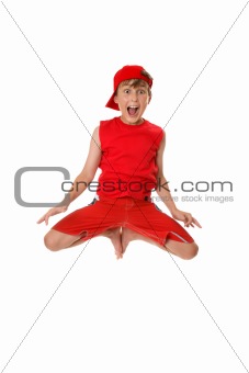 Excited boy jumping off the ground.