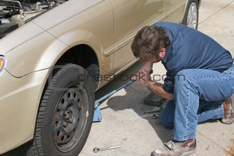 Mechanic Using Jack