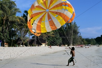 paragliding on sand beach