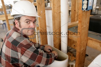 Plumber Working in Toilet Tank