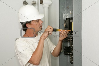 Electrician Installing Breaker
