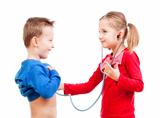 brother and sister playing a doctor with stethoscope - isolated on white