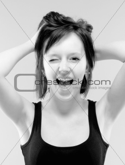 beautiful teenage girl in black screaming -  black and white