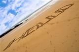 Hello inscribed on a sandy beach