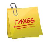 sticky note with text: taxes.