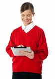 School girl using new touch pad device