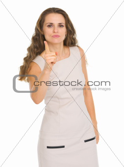 Serious young woman threatening with finger