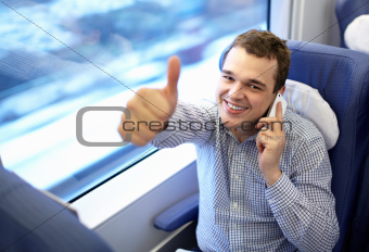 Young successful businessman in the train.