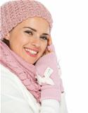 Portrait of smiling young woman in knit winter clothes