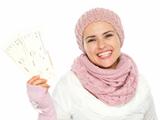Smiling woman in knit winter clothing holding air tickets