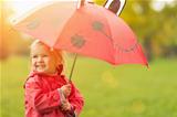 Happy baby with red umbrella