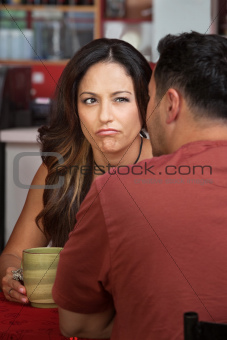 Frowning Woman Looking at Man