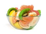 Fruit salad with citrus in a glass bowl