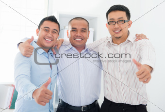 Thumbs up Southeast Asian businessmen 