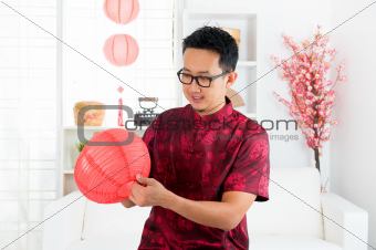 Chinese man decorating house
