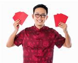 Asian Chinese man holding red packet 