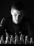 Teenage boy playing chess