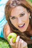Smiling Woman Eating Apple With Perfect Teeth