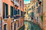 Small canal among old houses. Venice, Italy.