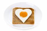heart shaped cooked egg on toast