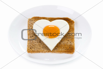 heart shaped cooked egg on toast