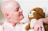 Cancer Patient Comforted by Teddy Bear