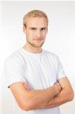 portrait of a young man with blond hair standing- isolated on white