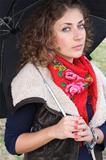 Beautiful curly hair woman with an umbrella