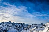 Winter High Tatras mountains landscape with blue cloudy sky