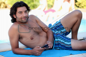 Man on beach towel
