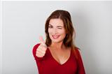 Happy woman with thumbs up