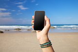blank screen mobile in the beach