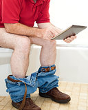 Man On Toilet with Tablet PC