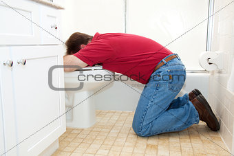 Man Throwing Up in Bathroom